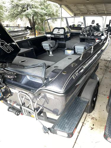 Slide: The Image of 2023 Triton 186 Fishunter boat, rear view, under shelter. - 3