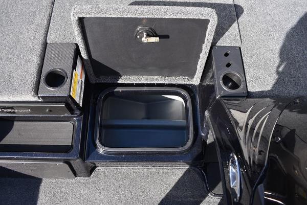 Slide: The Image of 2024 Triton 18 TrX boat storage compartment with open lid. - 1