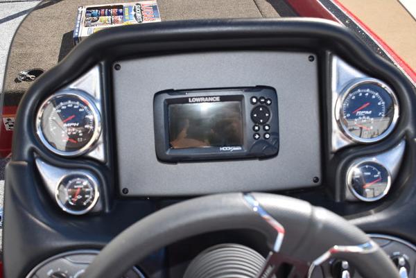 Slide: The Image of 2024 Triton 18 TrX boat dashboard with Lowrance fishfinder and gauges. - 10