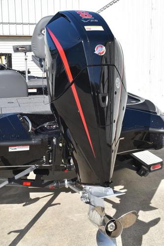 Slide: The Image of 2024 Triton 18 TrX boat with powerful outboard motor. - 12