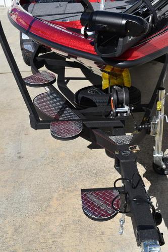 Slide: The Image of 2024 Triton 18 TrX boat trailer with custom steps and winch. - 12