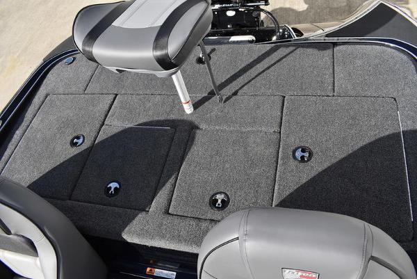 Slide: The Image of 2024 Triton 18 TrX boat deck with seating and storage compartments. - 13
