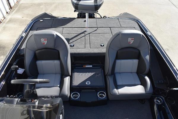 Slide: The Image of 2024 Triton 18 TrX boat interior with dual seats and steering console. - 14