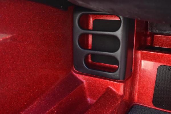 Slide: The Image of Close-up of 2024 Triton 18 TrX boat interior detail in red. - 17