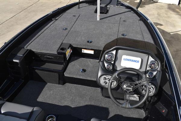 Slide: The Image of 2024 Triton 18 TrX boat interior with Lowrance electronics and spacious deck. - 20