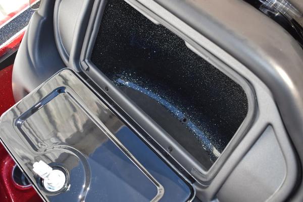 Slide: The Image of 2024 Triton 18 TrX boat storage compartment with open lid. - 21