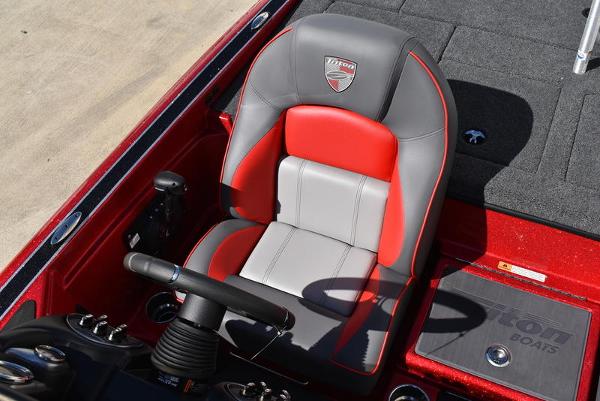 Slide: The Image of 2024 Triton 18 TrX boat captain's seat in red and gray. - 22