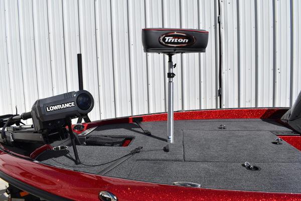 Slide: The Image of 2024 Triton 18 TrX boat deck with Lowrance fishfinder and Triton seat. - 28