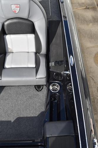 Slide: The Image of 2024 Triton 18 TrX boat interior with gray and black seating. - 29
