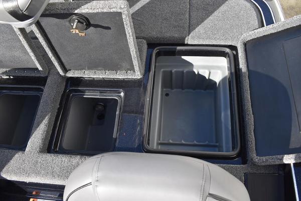 Slide: The Image of 2024 Triton 18 TrX boat storage compartments and seating area. - 30