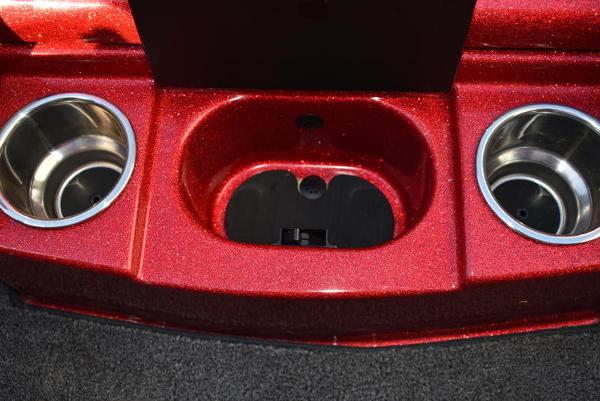 Slide: The Image of 2024 Triton 18 TrX boat console with cup holders and storage compartment. - 30