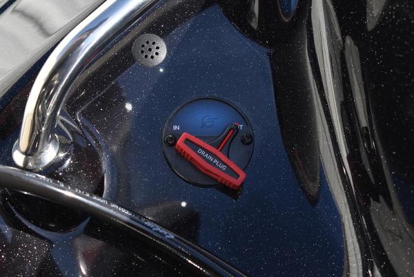 Slide: The Image of Close-up of 2024 Triton 18 TrX boat drain plug. - 31