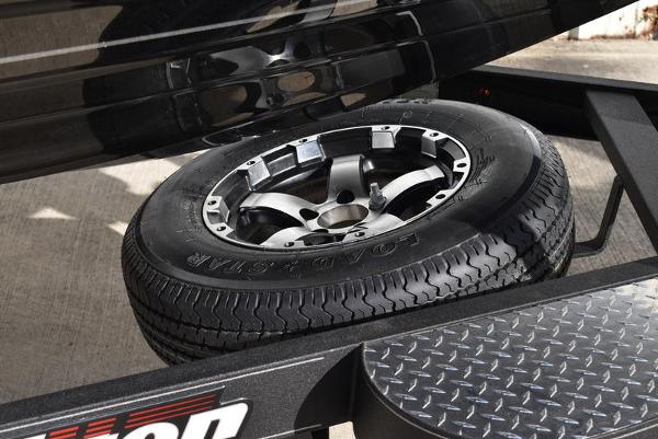 Slide: The Image of Spare tire on a 2024 Triton 18 TrX boat trailer. - 33