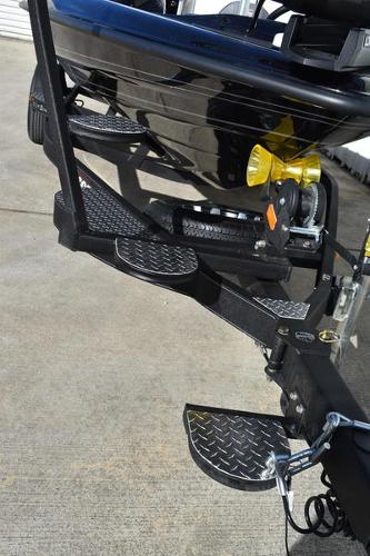 Slide: The Image of 2024 Triton 18 TrX boat trailer with diamond plate steps. - 34