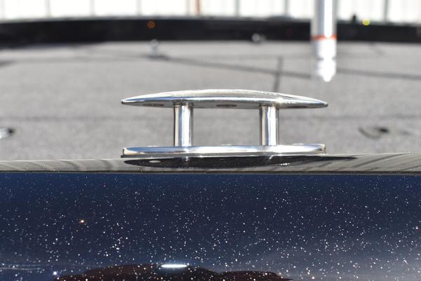 Slide: The Image of Close-up of a 2024 Triton 18 TrX boat cleat on a sparkling black surface. - 38