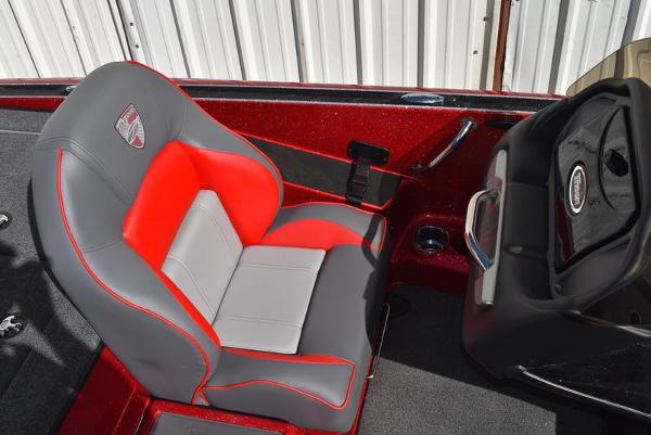 Slide: The Image of 2024 Triton 18 TrX boat with red and gray captain's seat. - 39