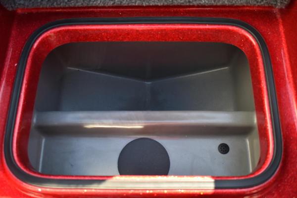 Slide: The Image of 2024 Triton 18 TrX boat storage compartment, red exterior. - 41