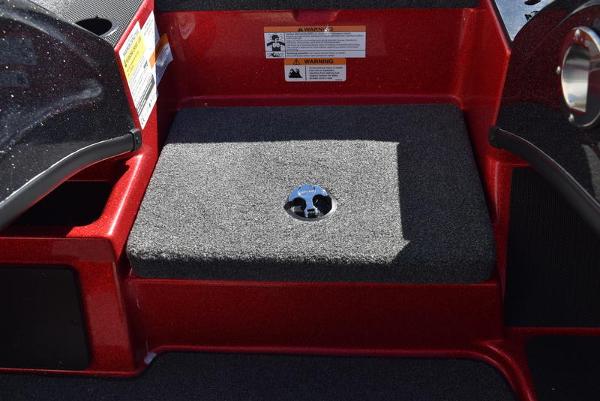 Slide: The Image of 2024 Triton 18 TrX boat interior with carpeted step and warning labels. - 43