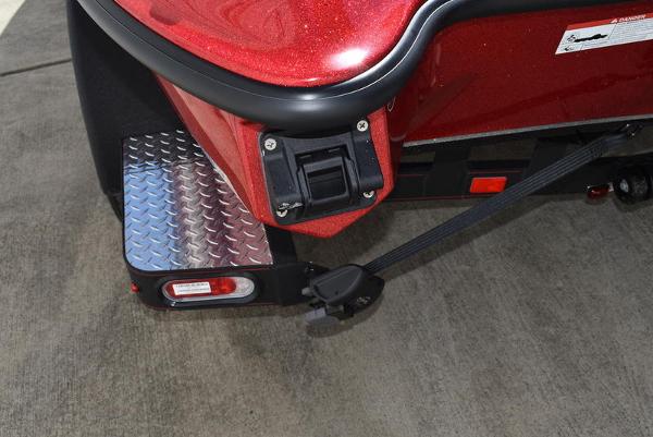 Slide: The Image of 2024 Triton 18 TrX boat rear corner with step and trailer light. - 44