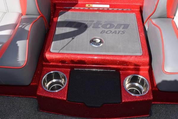 Slide: The Image of 2024 Triton 18 TrX boat interior with cup holders and storage compartment. - 6