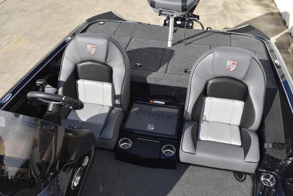 Slide: The Image of 2024 Triton 18 TrX boat interior with dual seats and steering console. - 9
