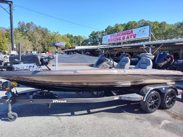 Slide: The Image of 2024 Triton 21 TrX bass boat on trailer at Sylacauga Marine & ATV dealership. - 1