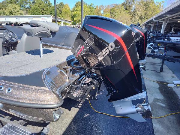 Slide: The Image of 2024 Triton 21 TrX boat with powerful outboard motor. - 3