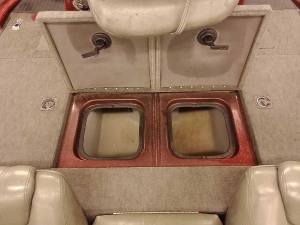 Slide: The Image of 2001 Triton TR186 sc boat interior with storage compartments and seating. - 27