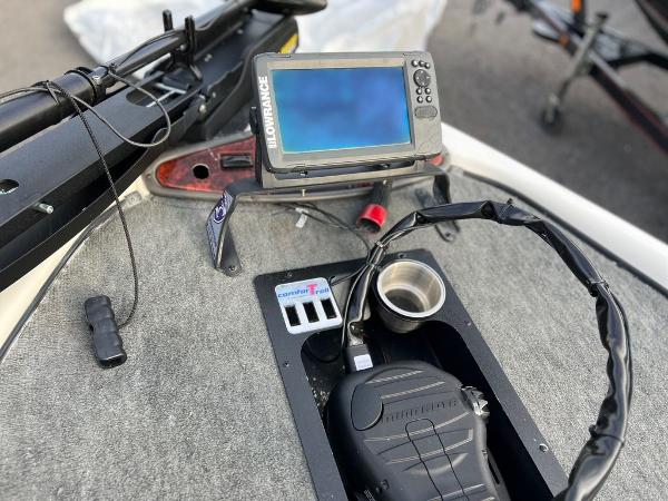Slide: The Image of 1999 Triton TR20 boat dashboard with Lowrance fishfinder and control panel. - 7