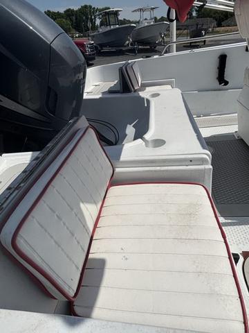 Slide: The Image of 2002 Triumph 190 Bay boat interior with white seating and motor. - 6