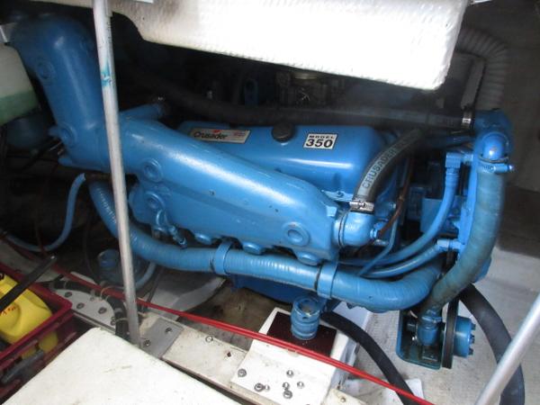 Slide: The Image of 1986 Trojan 11 Meter Convertible engine compartment with Crusader 350 engine. - 31