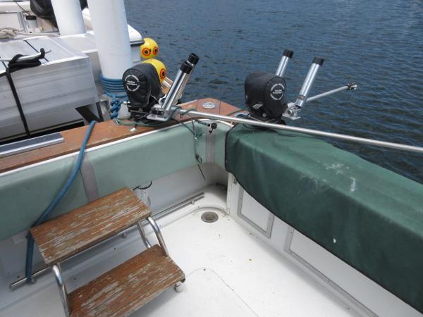 Slide: The Image of 1986 Trojan 11 Meter Convertible boat with fishing equipment on deck. - 5