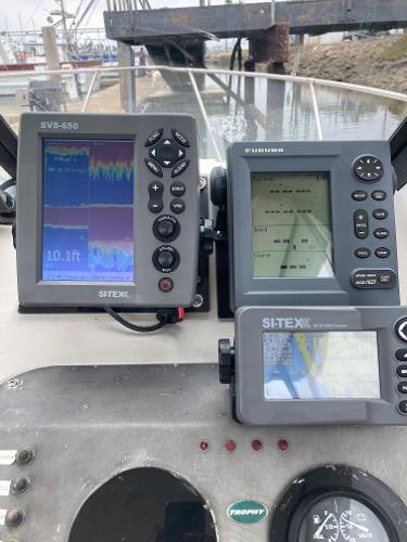 Slide: The Image of 2003 Trophy 2052 Walkaround boat with navigation and fish-finding equipment. - 10