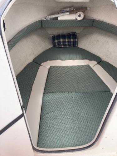 Slide: The Image of 2003 Trophy 2052 Walkaround cabin interior with green cushions and plaid pillow. - 14