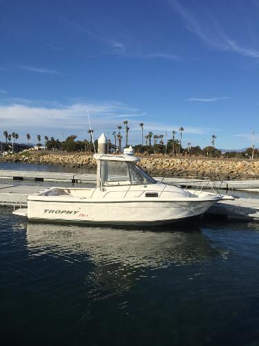 Slide: The Image of 2003 Trophy 2052 Walkaround boat docked in a marina. - 4