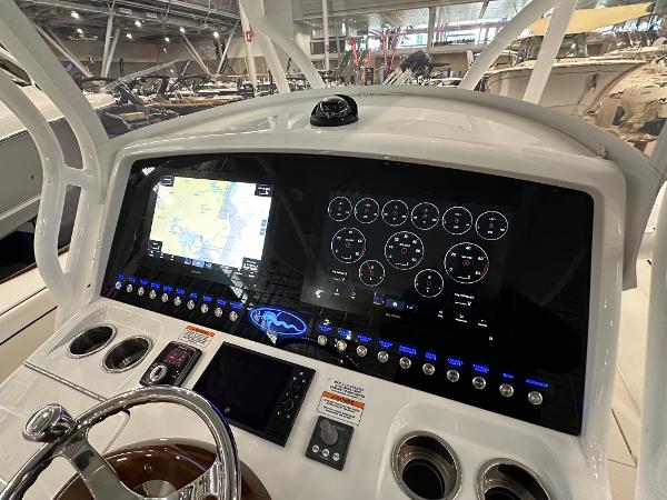 Slide: The Image of 2022 Valhalla V-33 Center Console dashboard with navigation and control displays. - 12