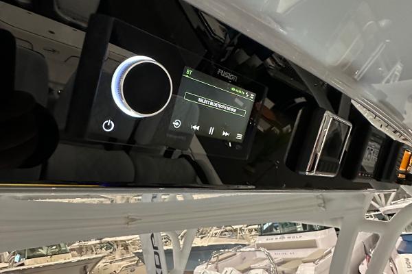 Slide: The Image of 2022 Valhalla V-33 Center Console dashboard with Fusion audio system. - 14