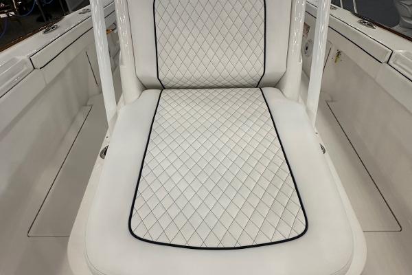 Slide: The Image of 2022 Valhalla V-33 Center Console with diamond-stitched white seating. - 23