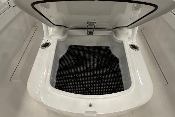 Slide: The Image of 2022 Valhalla V-33 Center Console storage compartment with open lid and black mat. - 24