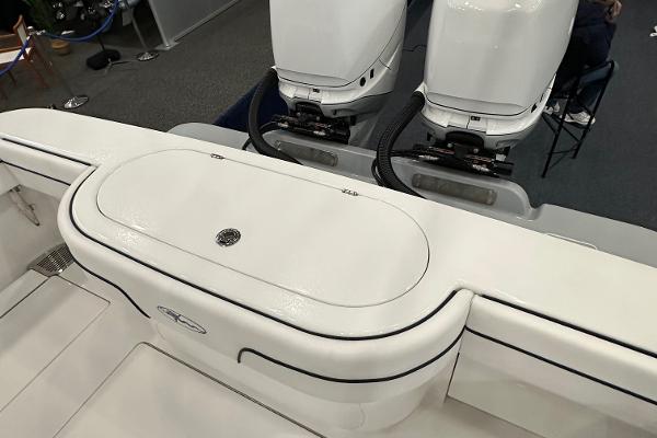 Slide: The Image of 2022 Valhalla V-33 Center Console boat with dual outboard engines, sleek white design. - 27