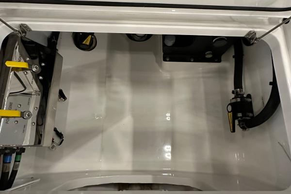 Slide: The Image of 2022 Valhalla V-33 Center Console storage compartment with mechanical components. - 28