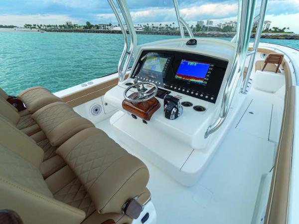 Slide: The Image of 2025 Valhalla Boatworks V-37 helm with advanced navigation system and luxurious seating. - 16