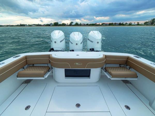 Slide: The Image of 2025 Valhalla Boatworks V-37 with triple Mercury outboard engines on open water. - 2