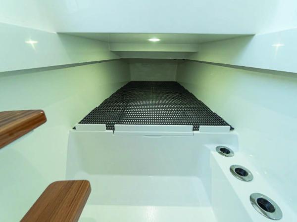 Slide: The Image of Interior cabin of 2025 Valhalla Boatworks V-37 with wooden steps and storage compartments. - 29