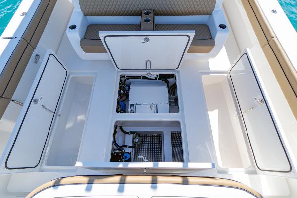 Slide: The Image of 2025 Valhalla Boatworks V-46 deck with open storage compartments and seating. - 10