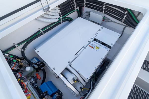 Slide: The Image of 2025 Valhalla Boatworks V-46 engine compartment with electrical components and wiring. - 11