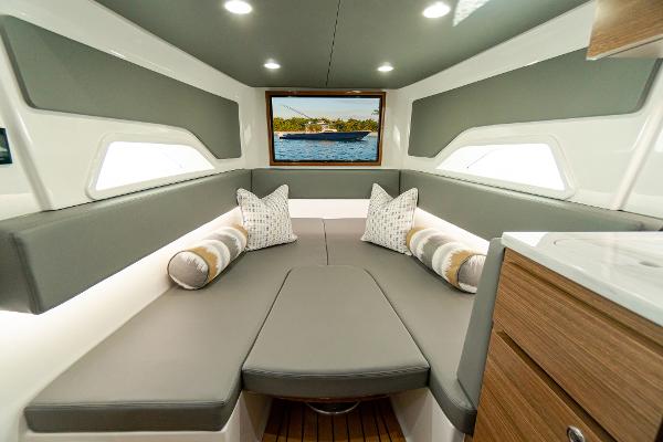 Slide: The Image of Luxurious interior of 2025 Valhalla Boatworks V-46 with elegant seating and scenic window view. - 22