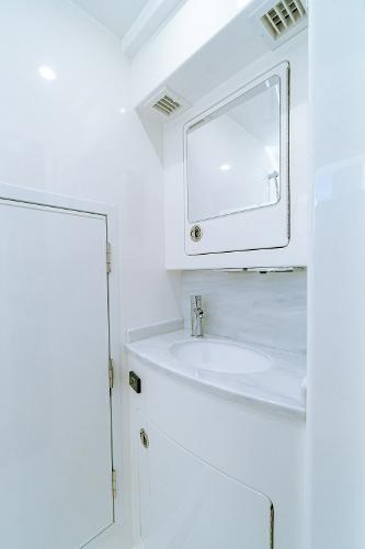 Slide: The Image of 2025 Valhalla Boatworks V-46 bathroom with sleek white design and modern fixtures. - 27