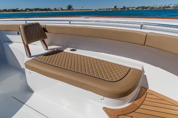 Slide: The Image of 2025 Valhalla Boatworks V-46 interior with tan quilted seating and ocean view. - 30