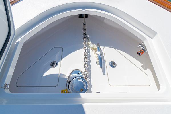 Slide: The Image of Anchor compartment of 2025 Valhalla Boatworks V-46, featuring chain and storage. - 32